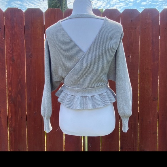 Saints + Secrets Faux Wrap Ribbed Ruffle Hem
Pink Sweater Size L - Picture 2 of 5